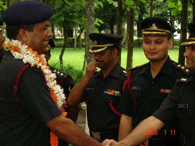 Garlanded at a farewell felicitation on relinquishing command of an artillery regiment