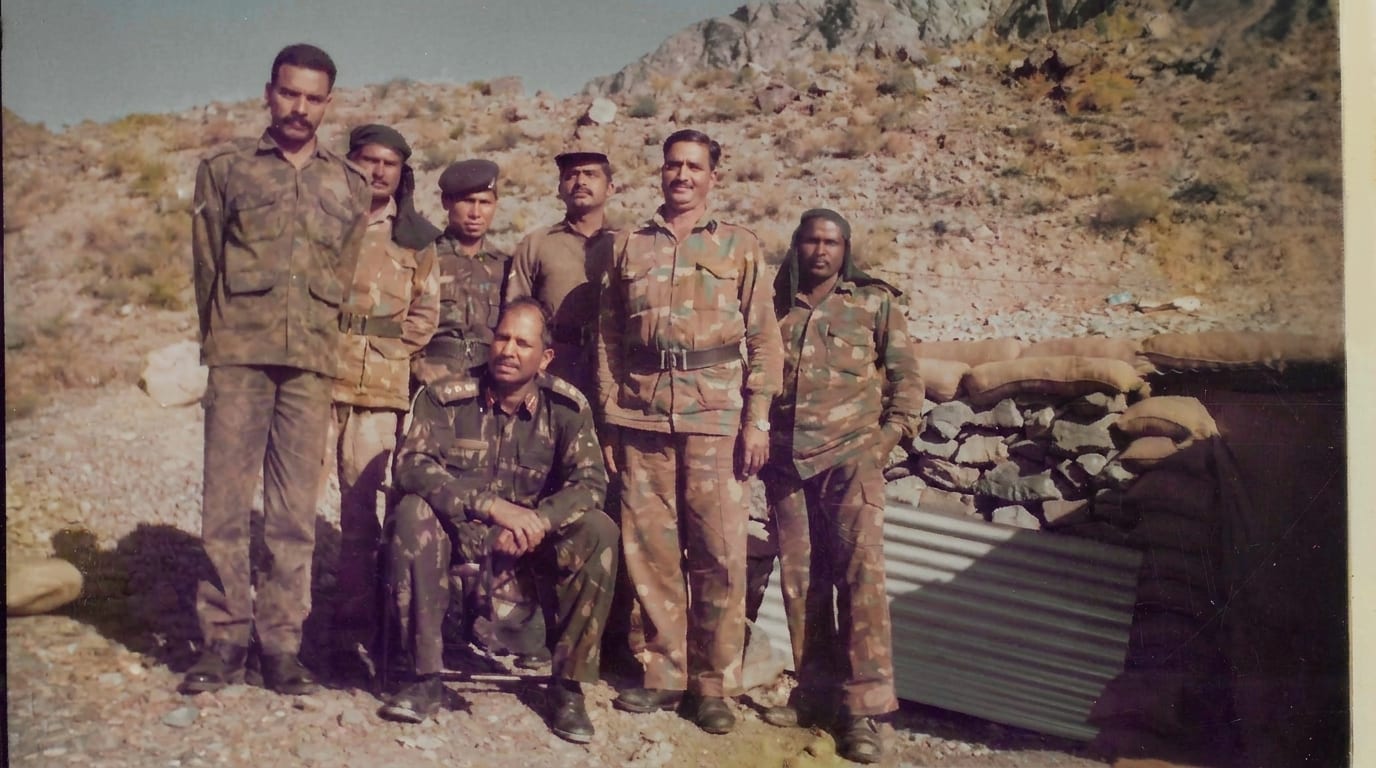 With officers and men at a forward post